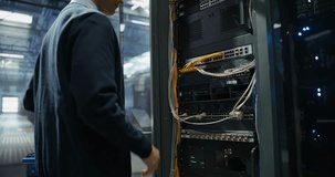 Server Technician Installing Additional Hardware into a Server Cabinet in a Data Center. Anonymous Specialist Inserting Hard Drives in Order to Increase Storage, Memory and Compute Power - Powered by Shutterstock - Get 15% off with code: PIKWIZARD15