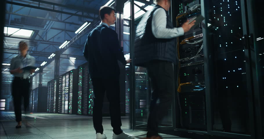 Timelapse Footage of Diverse Female and Male IT Professionals Working in a Technological Data Center Facility for AI Machine Learning. Specialists Using Computers, Walking, Installing Hardware
