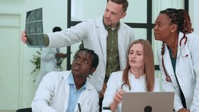 Medical team reviewing x-rays, collaborating on patient diagnosis, highlighting professional healthcare communication and collective expertise - Powered by Shutterstock - Get 15% off with code: PIKWIZARD15