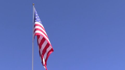 Unfurling American flag in the wind