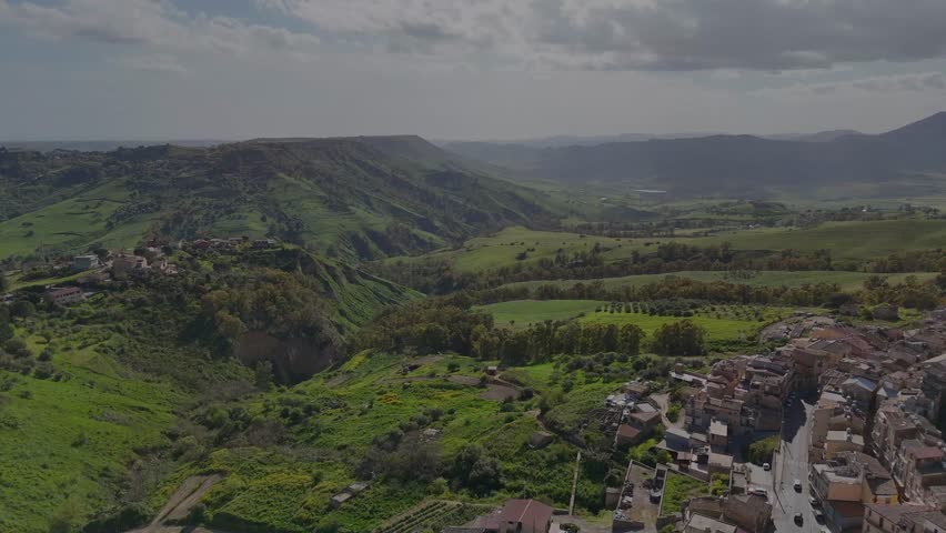 Flight over Sicily hills near Caltagirone countryside during spring day
