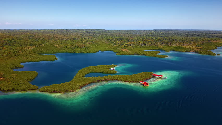 Tropical Green Island Boca del Drago In Bocas del Toro, Panama. wide aerial shot