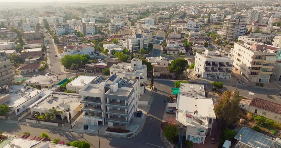 Scenic drone view of the capital of Cyprus Nicosia with urban buildings roads and business areas in a beautiful Mediterranean cityscape landscape.