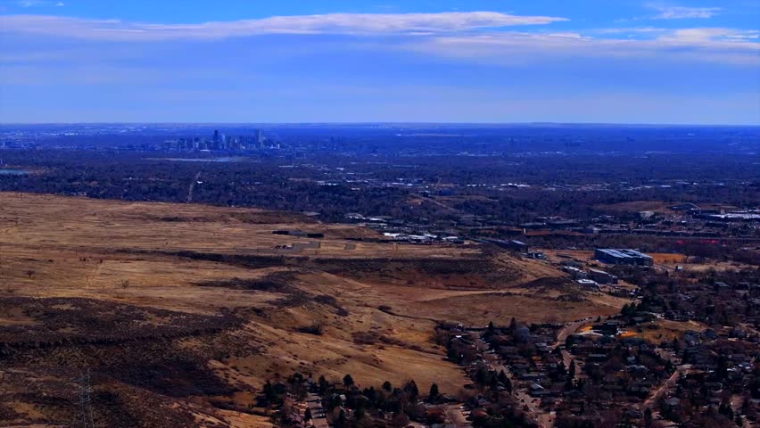 Lookout Mountain Golden Colorado aerial drone Downtown Denver cityscape from North Table Mesa daytime winter sunny clouds neighborhood Front Range Rocky Mountains Arvada Lakewood circle right motion
