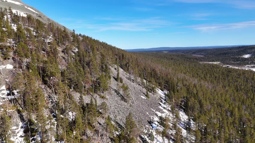 Aerial drone flight next to a mountainsidein Ylläs. Finland