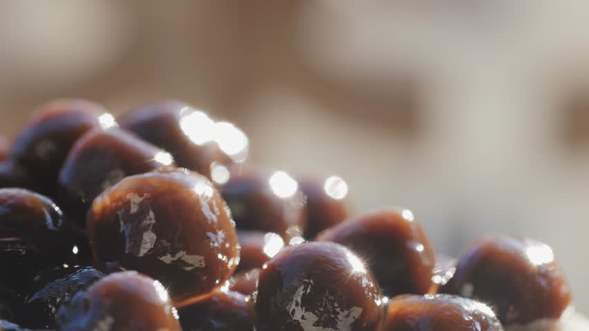 Cooking, boiling brown sugar flavor tapioca pearl balls, chinese food, ingredient of bubble tea, preparing food and drink, close up, recipe cookbook steps design concept.