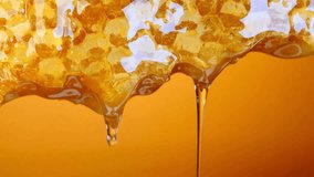 Golden Honey Dripping from Honeycomb Close-Up Texture - Powered by Shutterstock - Get 15% off with code: PIKWIZARD15