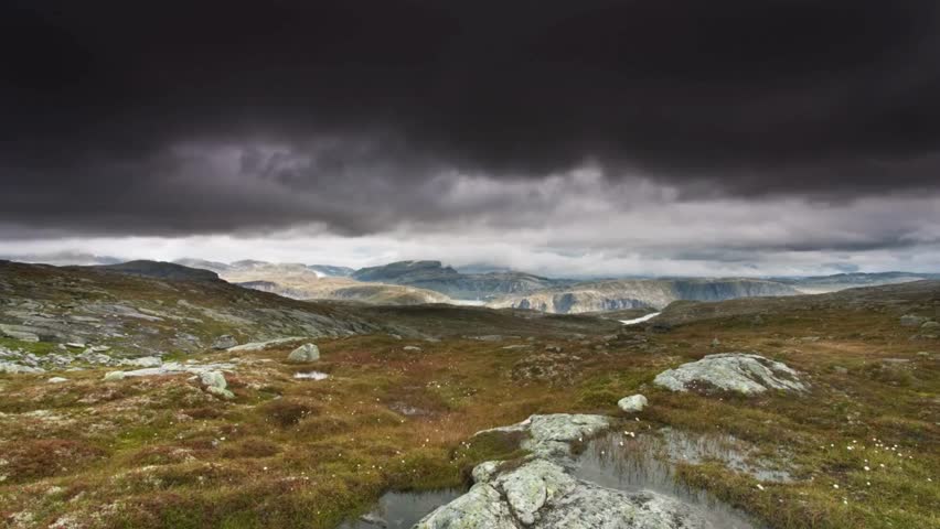 Dramatic Mountain Landscape Under a Dark Cloudy Sky