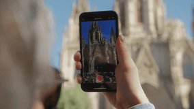 Man in barcelona blogger using smartphone phone, enjoying the view and relaxing in the sunny afternoon - Powered by Shutterstock - Get 15% off with code: PIKWIZARD15