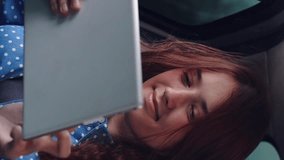 girl tablet car face smile window, car trip learning, female student online, online learning car, studying while traveling, window seat view, e-learning on road, car travel student, tablet working - Powered by Shutterstock - Get 15% off with code: PIKWIZARD15