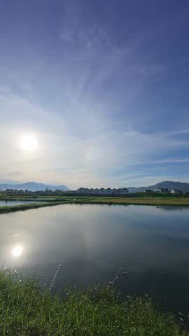 Scenic Reflection of Sky and Clouds on Pond