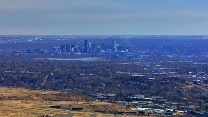 Downtown Denver cityscape from Lookout Mountain Golden North Table Mesa aerial drone Colorado daytime winter sunny clouds neighborhood Front Range Rocky Mountains Arvada Lakewood circle right motion
