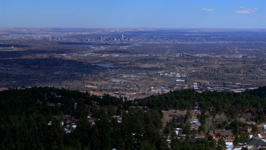 Lookout Mountain Golden Colorado aerial drone Downtown Denver cityscape from North Table Mesa daytime winter sunny clouds neighborhood Front Range Rocky Mountains Arvada Lakewood parallax right motion