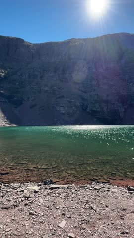 Beautiful and calm Cobalt Lake on a sunny fall day in Glacier National Park