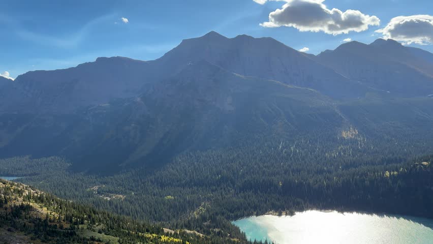 Majestic view of Grinnell Lake and Grinnell Glacier while hiking on a perfect autumn morning