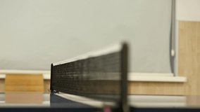 Close-up shot of a table tennis net with a subtle focus pull. The mesh and posts are detailed against a softly blurred indoor background. Ideal for sports. - Powered by Shutterstock - Get 15% off with code: PIKWIZARD15