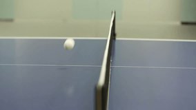 Close-up shot of a table tennis net with a subtle focus pull. The mesh and posts are detailed against a softly blurred indoor background. Ideal for sports. - Powered by Shutterstock - Get 15% off with code: PIKWIZARD15