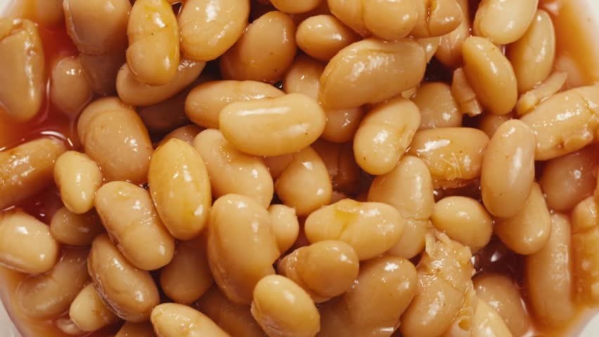 Canned red bans preserved beans rotating background close up side view. Organic steamed beans. Pickled bean for a Mexican dish