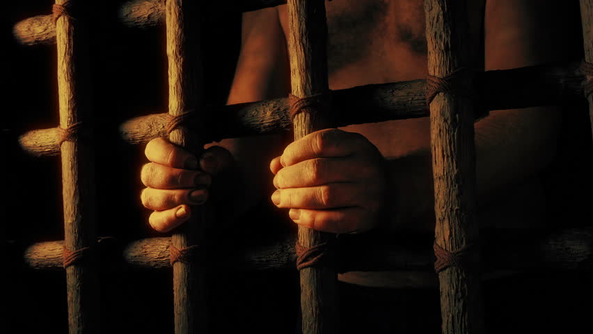 Man In Prison In Golden Light