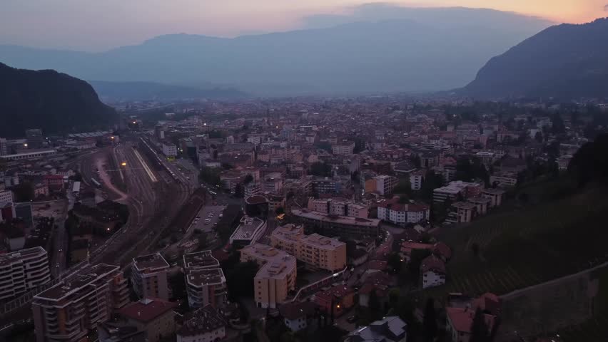 Bolzano City At Sunset In The South Tyrol Province Of Northern Italy. Aerial Drone Shot