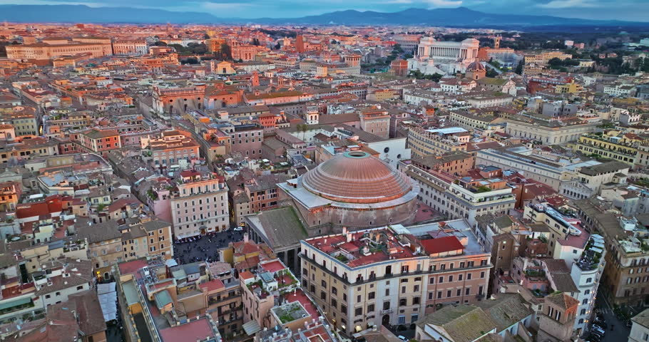 Pantheon facade in Rome, Italy, aerial descending on the ancient eternal Temple. Aerial view of Rome city rooftops. One of the most visited places by ladles from all over the world
