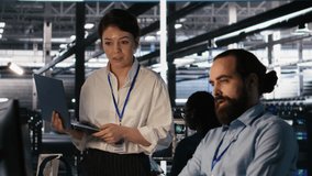 Data center admins working together, collaborating on neural network software development. Teamworking server hub colleagues implementing artificial intelligence technology in workplace, camera A - Powered by Shutterstock - Get 15% off with code: PIKWIZARD15