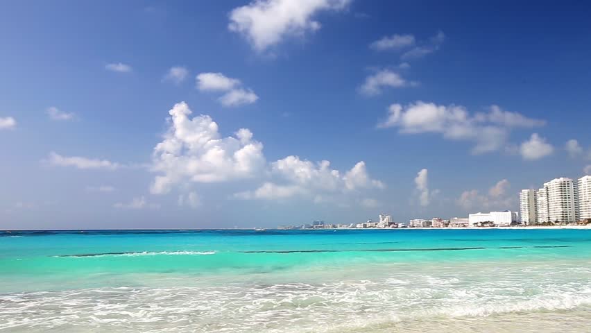 Cancun beach with blue water and resorts, Mexico
