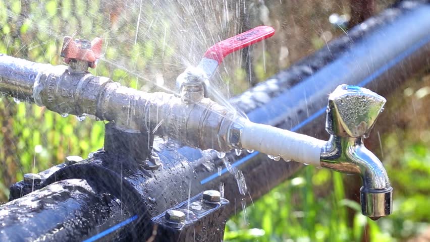 Water Leaking from broken faucet. Outdoors at the garden