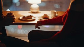 Tender couple holding hands at romantic night date in restaurant closeup. Affectionate spouses enjoying feelings sitting cafe table late evening. Smiling man confessing in love to beautiful woman. - Powered by Shutterstock - Get 15% off with code: PIKWIZARD15