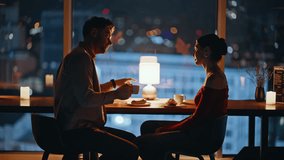 Silhouette happy pair talking at romantic dinner in night cafeteria. Smiling man woman enjoying bonding moments together in cafe blurred view. Loving married couple spending evening in dark restaurant - Powered by Shutterstock - Get 15% off with code: PIKWIZARD15