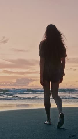 Beautiful Woman Walking on Sandy Beach and Wet Legs Stepping on Sand. Alone Adult Girl at Bright Scenic Sea Going Swim or Splash. Modern Romance of Ocean Bathing and Gorgeous Summer Sky at Shoreline
