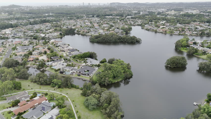 Aerial View Of Robina Island Park Lake And Gold Coast Waterfront Homes And Burleigh In Distance.Scenic Panoramic View Of Coastline Skyline QLD Australia