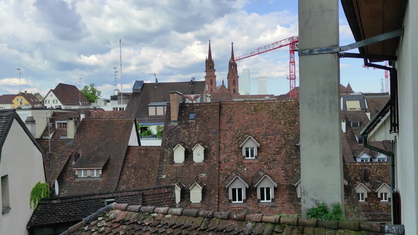 Rooftops and church in Basel, Switzerland. Medieval building style.