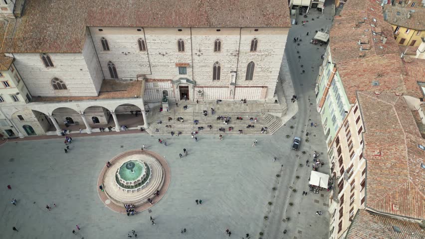 Italy, Umbria, Perugia drone aerial view .The Fontana Maggiore, located in Piazza IV Novembre ( Piazza Grande), is the symbolic monument of the city of Perugia and the roofs of the houses 