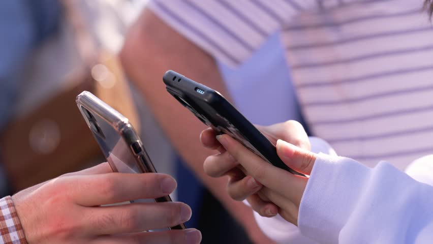 Contactless payment with smartphone. Sharing contact information through smartphones. Sending and receiving information with smartphones. Communication and Connection. Scan QR code.