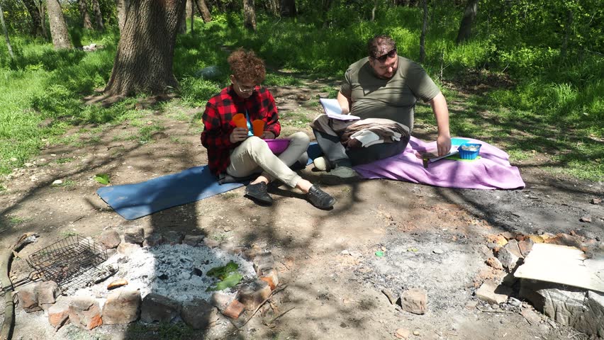 Picnic in the old park. Two friends in nature.
