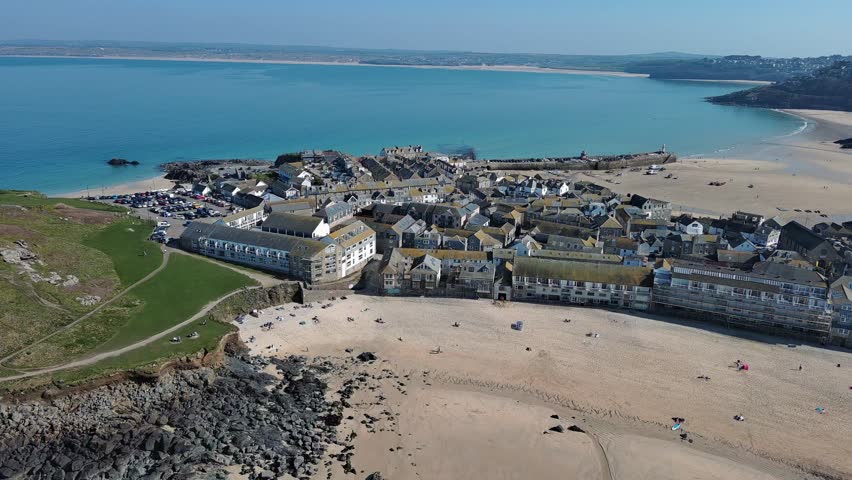 An aerial view of the seafront buildings, St Ives Harbour and Smeaton