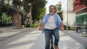 Happy active senior man doing healthy exercise riding bicycle in the city - Powered by Shutterstock - Get 15% off with code: PIKWIZARD15
