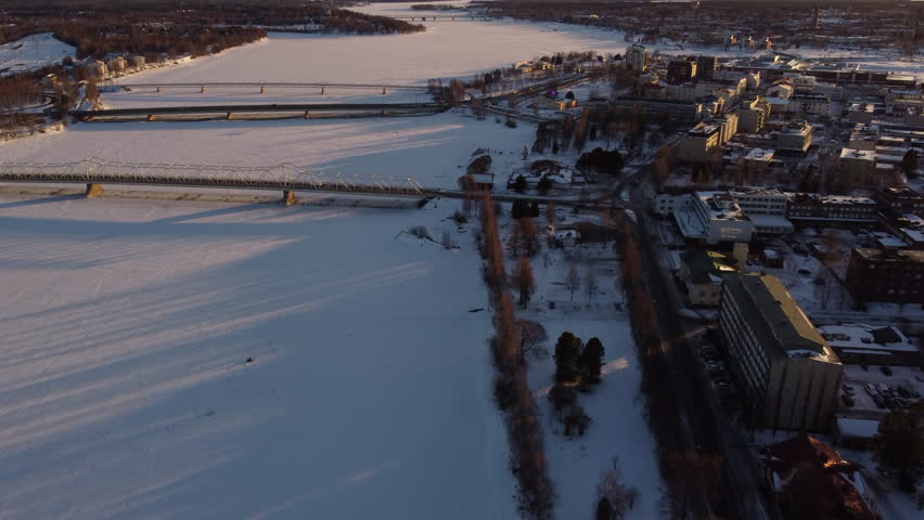 Bridges Over Frozen Snow-Covered River in Tornio Finland AERIAL