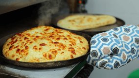 Cooking Ossetian pie with cottage cheese and cheese in an oven - Powered by Shutterstock - Get 15% off with code: PIKWIZARD15