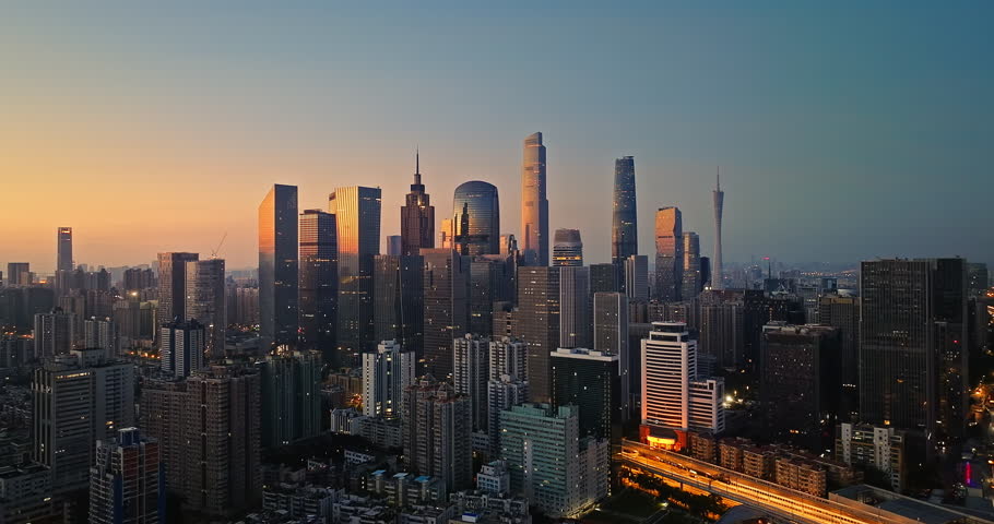 Aerial view of beautiful city skyline and modern buildings scenery at sunrise in Guangzhou, China.