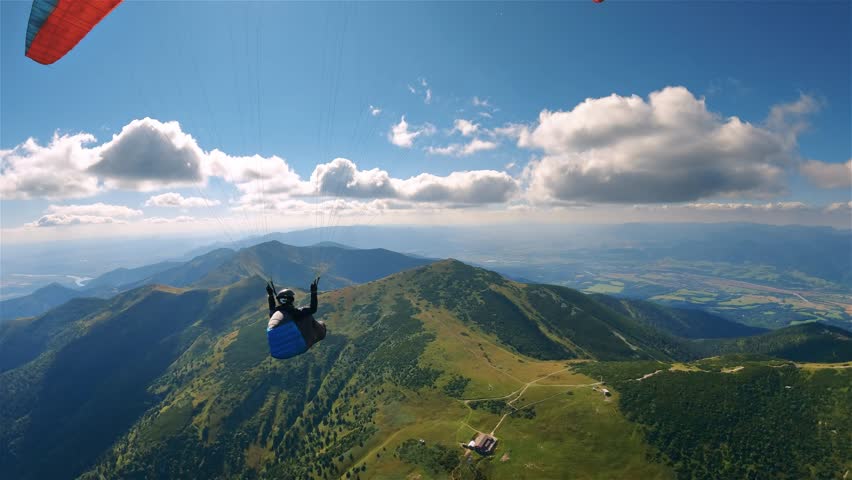 Paragliding Freedom of Peaceful Flying Above Green Mountains