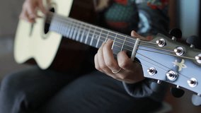 Musician's fingers skillfully playing acoustic guitar chords, creating melodic sound with intricate finger movements on fretboard - Powered by Shutterstock - Get 15% off with code: PIKWIZARD15