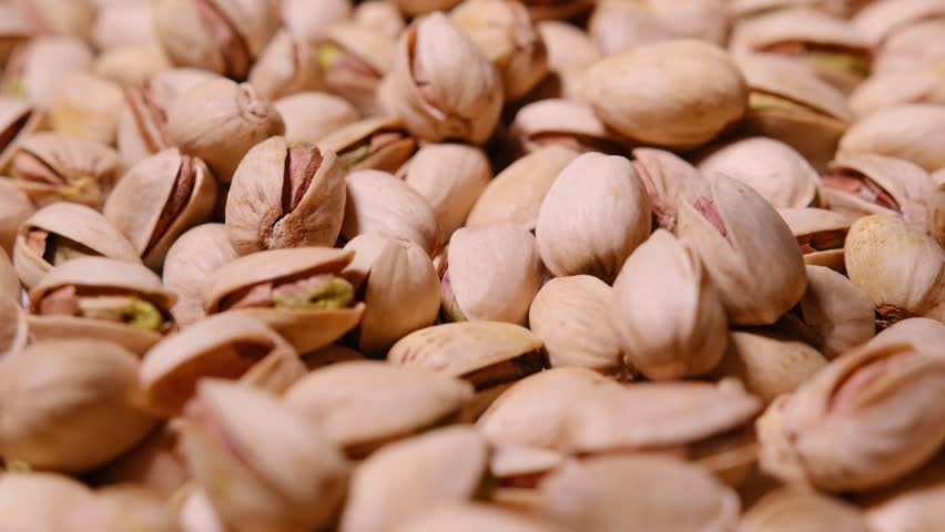 A delightful close up of fresh shelled pistachios, showcasing their vibrant green color
