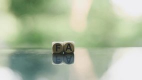 close up FAQ wooden text block on wood table, Frequently Asked Questions - Powered by Shutterstock - Get 15% off with code: PIKWIZARD15