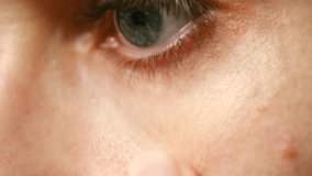 Close-up beauty shot shows woman applying concealer under her eye cover dark circles, demonstrating simple makeup technique for fresh look. Woman applying concealer makeup on eye bags. Everyday makeup - Powered by Shutterstock - Get 15% off with code: PIKWIZARD15