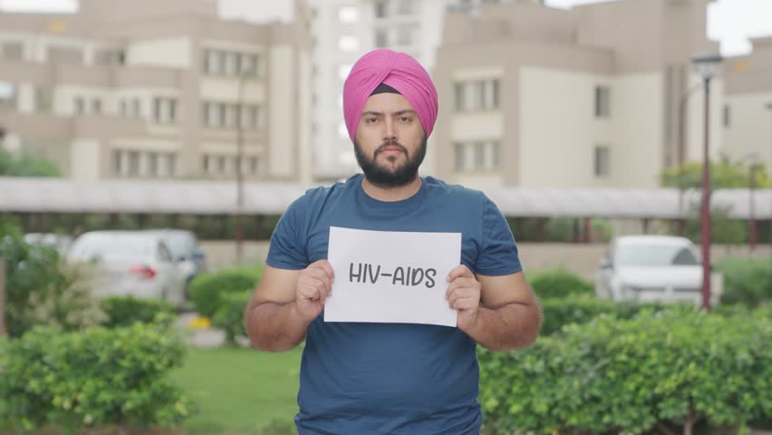 Sikh Indian Man Holding HIV AIDS Poster