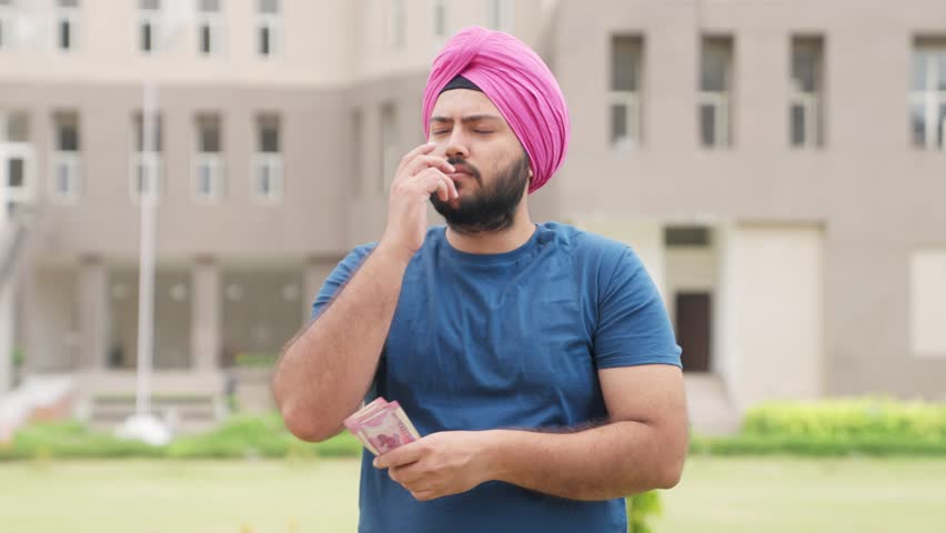 Confussed Sikh Indian Man Counting Money, 2000 Indian Rupees