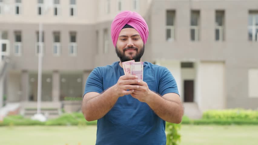 Sikh Indian Man Counting Money, 2000 Indian Rupees