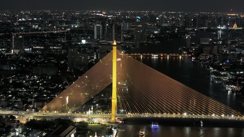 Drone view at night of Rama VIII Bridge in Bangkok, Thailand